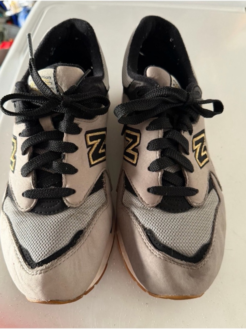 New Balance 1600 sneakers in the 'Grey Black Gold' colorway from the Lost World